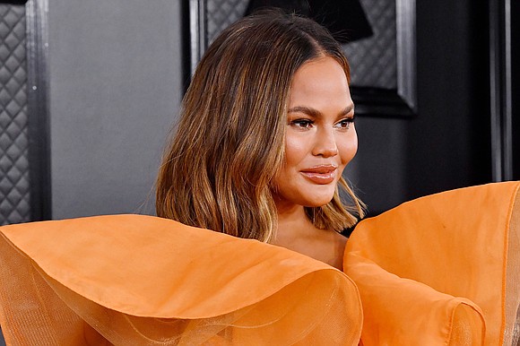 Chrissy Teigen admits she loves "Selling Sunset," even as she's questioned whether the TV show's stars are, in fact, real …