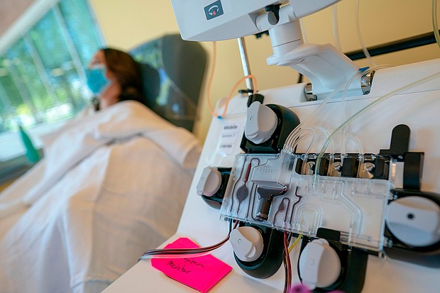 Mckinley Edelman, 26, a recovered COVID-19 patient, donates plasma to MedStar Georgetown University Hospital at Inova Blood Services on April 22, 2020 in Dulles, Virginia./Credit:	Alex Edelman/AFP/Getty Images