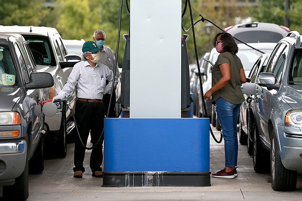 People wait in long lines for gas at Costo as they prepare for Hurricane Marco and Tropical Storm Laura on August 23, 2020 in New Orleans, Louisiana./Credit:	Sean Gardner/Getty Images
