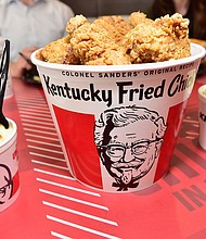Kentucky Fried Chicken has decided to pause using its "finger lickin' good" slogan because ... well, that's probably not the best idea right now./Credit:	Moses Robinson/Getty Images for KFC