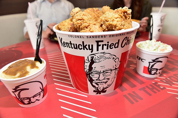 Kentucky Fried Chicken has decided to pause using its "finger lickin' good" slogan because ... well, that's probably not the best idea right now./Credit:	Moses Robinson/Getty Images for KFC