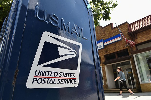 Two Democratic super PACs are launching a $7.5 million advertising campaign to encourage voters to request mail-in ballots in several states crucial to their party's hopes of winning the White House and flipping control of the Senate./Credit:	MANDEL NGAN/AFP/AFP via Getty Images