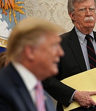 National Security Adviser John Bolton listens to U.S. President Donald Trump speak during a meeting with Egyptian President Abdel-Fattah el-Sisi in the Oval Office of the White House April 9, 2019 in Washington, DC.
Credit:	Alex Wong/Getty Images