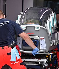 German army emergency personnel load the stretcher that was used to transport Russian opposition figure Alexei Navalny into an ambulance on August 22, 2020 at Berlin's Charite hospital./Credit:	JOHN MACDOUGALL/AFP/AFP via Getty Images
