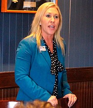 In this file photo, Republican Marjorie Taylor Greene speaks to a GOP women's group in Rome, Ga./Credit:	John Bailey/Rome News Tribune/AP