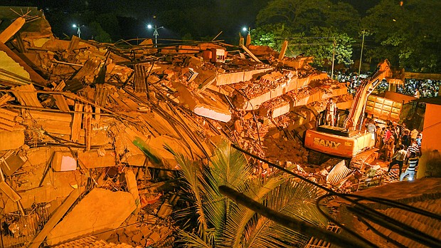 Up to 60 people are believed to be trapped after the five-story building in Mahad city collapsed./Credit:	PRITAM SAKPAL/AFP via Getty Images