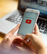 YouTube is increasingly relying on technology to moderate content, resulting in a sharp rise in removed videos, including some that didn't violate its policies./Credit:	Shutterstock