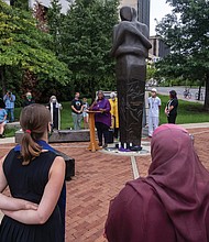 Amid the pandemic, an interfaith group of clergy gathers at the Reconciliation Statue in Downtown for a prayer vigil for those who have died from COVID-19. The Rev. Lacette R. Cross, pastor of Restoration Fellowship RVA and director of volunteers and outreach at Side by Side, delivers a call to action. The vigil, held Aug. 18, also was to show support for the Virginia COVID-19 Justice Coalition’s effort to gain release of nonviolent inmates from jails and prisons in the state due to the virus threat. Location: 15th and Main streets.