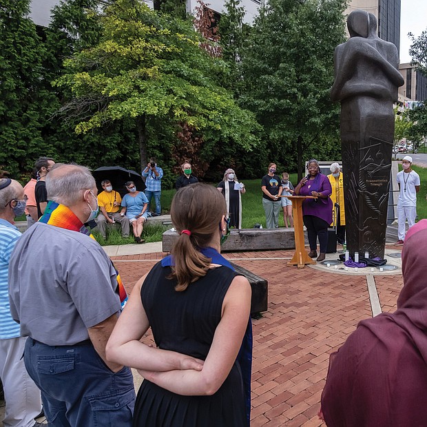 Amid the pandemic, an interfaith group of clergy gathers at the Reconciliation Statue in Downtown for a prayer vigil for those who have died from COVID-19. The Rev. Lacette R. Cross, pastor of Restoration Fellowship RVA and director of volunteers and outreach at Side by Side, delivers a call to action. The vigil, held Aug. 18, also was to show support for the Virginia COVID-19 Justice Coalition’s effort to gain release of nonviolent inmates from jails and prisons in the state due to the virus threat. Location: 15th and Main streets.
