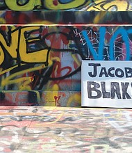 The Lee statue remains a place for people to place names of those shot wrongfully by police, including the latest man, Jacob Blake of Kenosha, Wis., who was shot in the back multiple times by police Sunday while his three children watched.