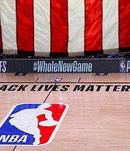 The NBA and the players association say competition will resume Saturday, with no playoff games Friday./Credit:	Kevin C. Cox/Pool/AP