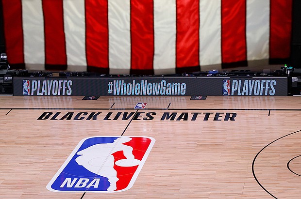 The NBA and the players association say competition will resume Saturday, with no playoff games Friday./Credit: Kevin C. Cox/Pool/AP