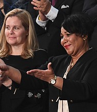 President Donald Trump granted Alice Marie Johnson a pardon on Friday, after commuting her prison sentence two years ago./Credit:	Saul Loeb/AFP/Getty Images