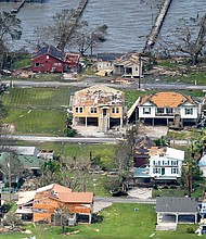 FEMA has enough money to cover unemployment and disaster relief. This image shows buildings and homes damaged in the aftermath of Hurricane Laura Thursday, August 27, near Lake Charles, LA.
Credit:	David J. Phillip/AP