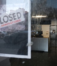 A shuttered business is shown in Brooklyn, NY. New York City. A surge in corporate bankruptcies is adding to a difficult labor market./Credit: Spencer Platt/Getty Images
