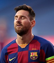 Messi has won 10 La Liga titles and the Champions League four times with . Barcelona./Credit:	MANU FERNANDEZ/AFP/POOL/AFP via Getty Images