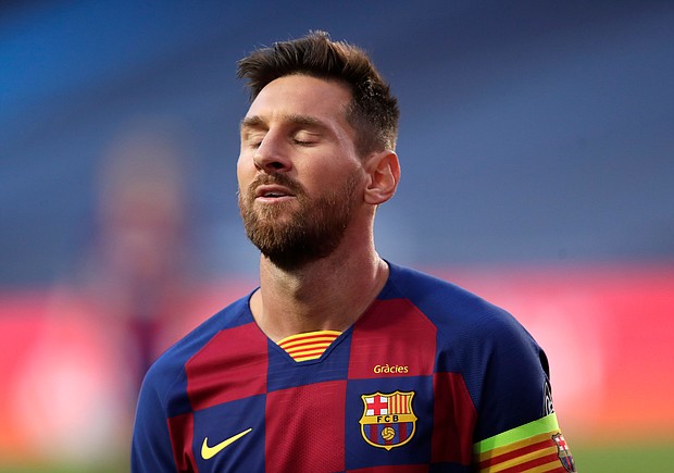 Messi has won 10 La Liga titles and the Champions League four times with . Barcelona./Credit:	MANU FERNANDEZ/AFP/POOL/AFP via Getty Images
