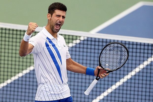 Djokovic celebrates defeating Milos Raonic in the final of the Western & Southern Open./Credit:	Matthew Stockman/Getty Images North America/Getty Images