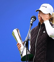 Sophia Popov of Germany holds the trophy as she gives a speech following victory in the final round during Day Four of the 2020 AIG Women's Open at Royal Troon on August 23, 2020 in Troon, Scotland./Credit:	Richard Heathcote/R&A/Getty Images