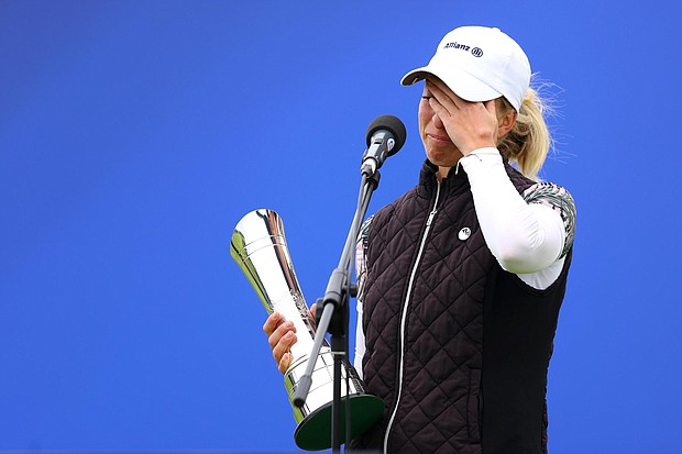 Sophia Popov of Germany holds the trophy as she gives a speech following victory in the final round during Day Four of the 2020 AIG Women's Open at Royal Troon on August 23, 2020 in Troon, Scotland./Credit:	Richard Heathcote/R&A/Getty Images