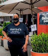 Harlem restaurateur Melba Wilson stands in front of her namesake restaurant on July 23, 2020 in Harlem, New York./Credit:	Anthony Jones