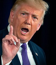 US President Donald Trump speaks during a press conference in Bedminster, New Jersey, on August 15, 2020. Donald Trump said August 15, 2020 he will try a controversial "snapback" to force a return of UN sanctions against Iran, after the Security Council rejected Washington's bid to extend the arms embargo against the Islamic republic./Credit:	JIM WATSON/AFP/AFP via Getty Images