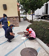 Two children outside a Taco Bell in Salinas, California using the free WiFi to do schoolwork. The poster of this image obscured the faces of these children pictured./Credit:	From Luis Alejo/Twitter
