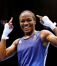 Nicola Adams celebrates winning gold at the 2012 Olympic Games in London. She recently announced her retirement due to fears she could go blind if she continues boxing./Credit:	Scott Heavey/Getty Images Europe/Getty Images