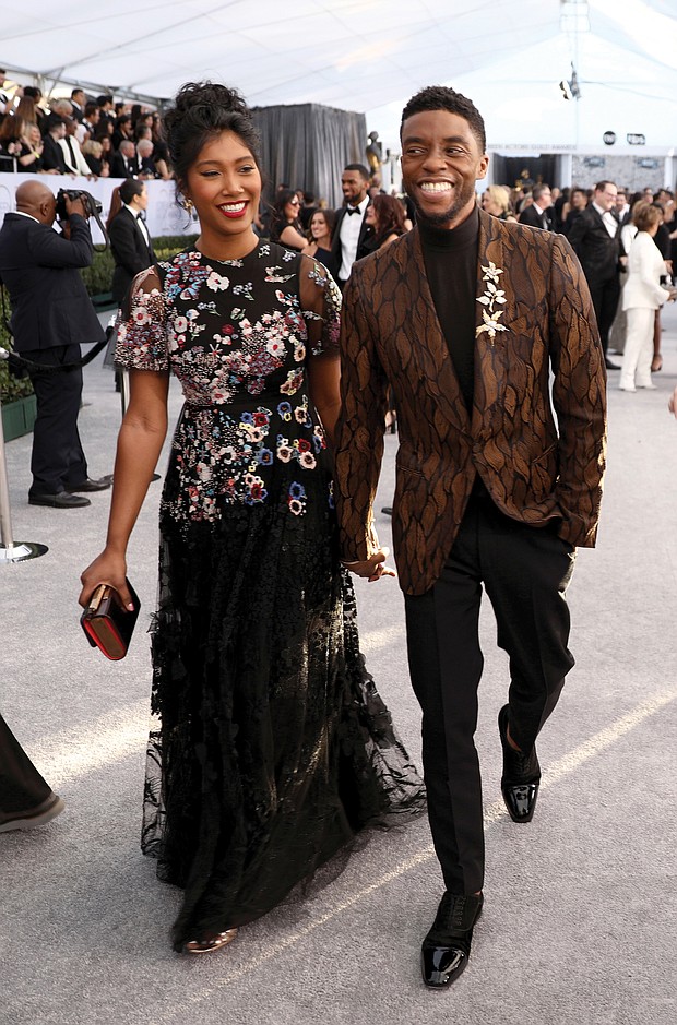 A happy Chadwick Boseman and Taylor Simone Ledward arrive at the Screen Actors Guild Awards in Los Angeles in this photo from Jan. 27, 2019. The two married in a private ceremony prior to his death.