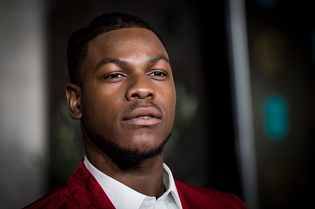 When Disney first revealed John Boyega as a stormtrooper in "The Force Awakens," he immediately became the target of racist comments from "Star Wars" fans protesting the casting of a Black person in the role./Credit:	Tristan Fewings/Getty Images