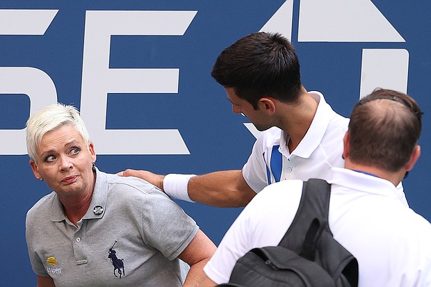 Novak Djokovic apologizes to the line judge./Credit:	Al Bello/Getty Images North America/Getty Images