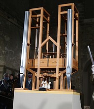 Soprano Johanna Vargas and composer Julian Lembke use the organ pipes during the chord change ceremony./Credit:	Matthias Bein/picture alliance/dpa/Getty Images