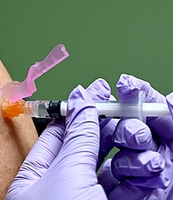 A man gets a flu shot at a health facility in Washington, DC January 31, 2020. - The weekly US influenza surveillance report from the Centers for Disease Controle (CDC) reports that flu activity remains high in week 4, ending January 25, 2020 and increased over the past two weeks. The CDC estimates that so far this season there have been at least 19 million flu illnesses in the US, 180,000 hospitalizations and 10,000 deaths from flu. Flu vaccine effectiveness estimates are not available yet this season./Credit:	Eva Hambach/AFP/Getty Images