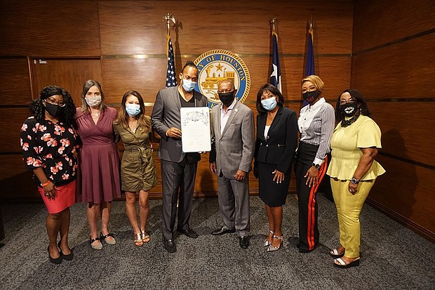 Pictured left to right: Kimberly Hatter, Debbie McNulty, Junie Hoang, Greg Carter, Mayor Sylvester Turner, Dominque Telson, Jalene Mack, Lyn Samuels