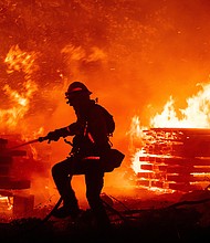 Firefighters battle the fast growing Creek Fire./Credit:	Josh Edelson/AFP/Getty Images