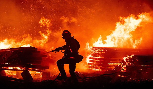 Firefighters battle the fast growing Creek Fire./Credit:	Josh Edelson/AFP/Getty Images