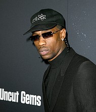 Travis Scott arrives at the premiere of A24's "Uncut Gems" at The Dome at Arclight Hollywood on December 11, 2019 in Hollywood, California./Credit:	Kevin Winter/Getty Images