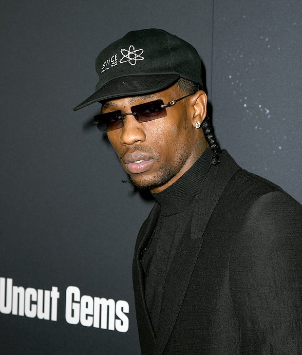 Travis Scott arrives at the premiere of A24's "Uncut Gems" at The Dome at Arclight Hollywood on December 11, 2019 in Hollywood, California./Credit:	Kevin Winter/Getty Images