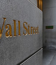 A man walks near the New York Stock Exchange on August 31, 2020 at Wall Street in New York City./Credit:	Angela Weiss/AFP/Getty Images