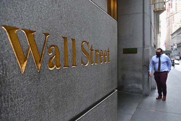 A man walks near the New York Stock Exchange on August 31, 2020 at Wall Street in New York City./Credit:	Angela Weiss/AFP/Getty Images
