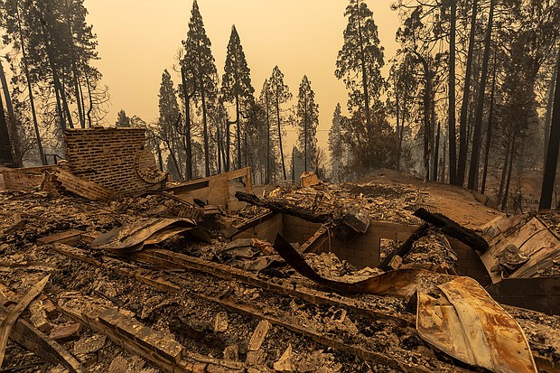A community of forest homes lies in ruins along Auberry Road in the Meadow Lakes area after the Creek Fire swept through on September 8, 2020 near Shaver Lake, California./Credit:	David McNew/Getty Images