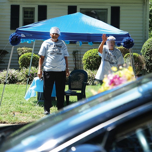 Frank and Charlotte Strayhorn have celebrated a lot of anniversaries, but their 65th — celebrated during the coronavirus pandemic—is one they’ll always remember. The couple, both 87, were feted Saturday by friends and relatives in a parade of about 50 vehicles that drove by the couple’s home on Edgewood Avenue in North Side to offer con- gratulations. The Strayhorns, who were married in 1955 in Anchorage, Alaska, where he was serving in the military, were set up on the lawn outside their home where they waved and talked with the
caravan of well-wishers. The Strayhorns’ sons, Ronald, Peter and Michael Strayhorn, had planned a 65th anniversary party but then COVID-19 hit. So with all three living out of state in COVID- 19 hotspots, they arranged the celebration with the help of cousins living in the Richmond area.