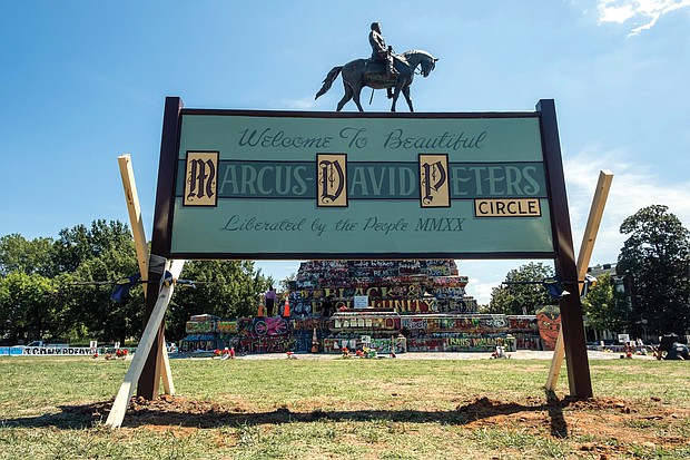 A new sign now sits on the grassy circle at Monument and Allen avenues where the Robert E. Lee statue sits. The original sign informally renaming the circle for Marcus-David Peters, a 24-year-old high school biology teacher who was shot and killed by Richmond Police officer in 2018 during what has been described as a mental crisis, was cut down by an unknown person or people around Aug. 16. State officials and law enforcement said at the time there was no official order for its removal. The new sign was put in place Aug. 30.