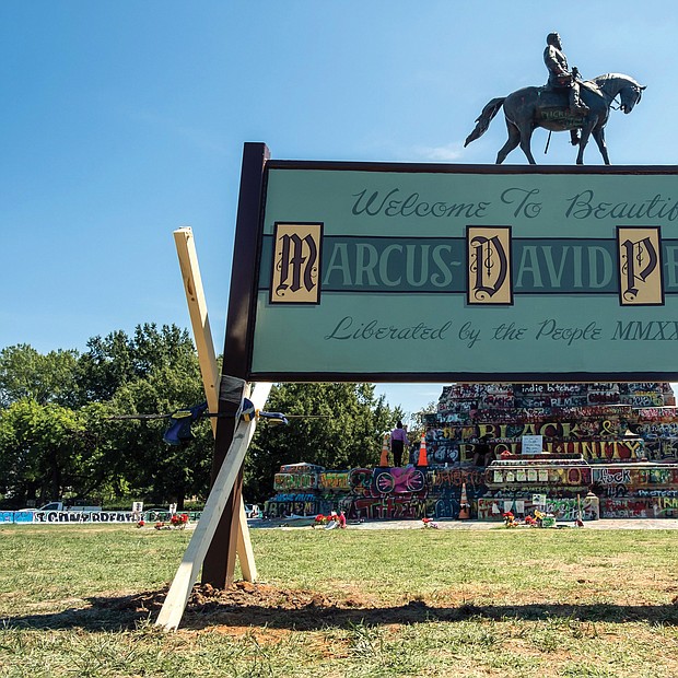A new sign now sits on the grassy circle at Monument and Allen avenues where the Robert E. Lee statue sits. The original sign informally renaming the circle for Marcus-David Peters, a 24-year-old high school biology teacher who was shot and killed by Richmond Police officer in 2018 during what has been described as a mental crisis, was cut down by an unknown person or people around Aug. 16. State officials and law enforcement said at the time there was no official order for its removal. The new sign was put in place Aug. 30.