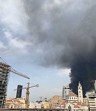 Smoke rises from a huge fire raging in Beirut port on September 10, 2020./Credit:	Joseph Eid/AFP/Getty Images