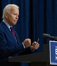 Democratic presidential candidate former Vice President Joe Biden shakes his fists as he speaks in Wilmington, Del., Friday Sept. 4, 2020./Credit:	Carolyn Kaster/AP