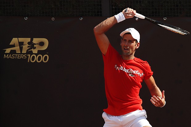 Djokovic returns a forehand during a practice session in Rome, Italy./Credit:	CLIVE BRUNSKILL/AFP/POOL/AFP via Getty Images