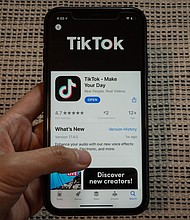 The download page for ByteDance Ltd.'s TikTok app on the Apple Inc. App Store is displayed on a smartphone in an arranged photograph in Beijing, China, on September 1, 2020./Credit:	Yan Cong/Bloomberg/Getty Images