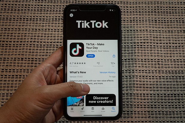 The download page for ByteDance Ltd.'s TikTok app on the Apple Inc. App Store is displayed on a smartphone in an arranged photograph in Beijing, China, on September 1, 2020./Credit:	Yan Cong/Bloomberg/Getty Images