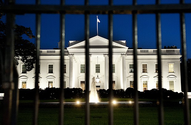 The White House is seen at dusk on the eve of a possible government shutdown as Congress battles out the budget in Washington, DC, September 30, 2013./Credit:	Saul Loeb/AFP/Getty Images
